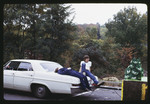 Students Relaxing by a Homecoming Float, 1971 by Montclair State College